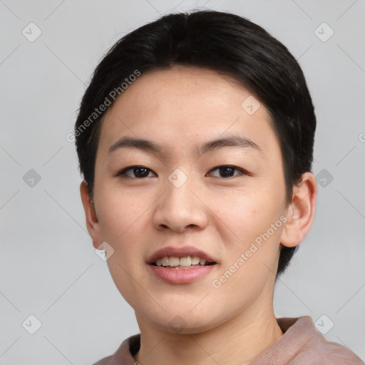 Joyful asian young-adult female with short  black hair and brown eyes