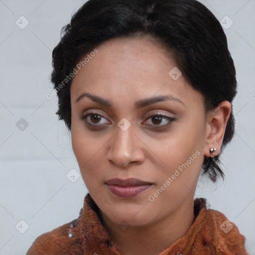 Joyful black young-adult female with long  brown hair and brown eyes