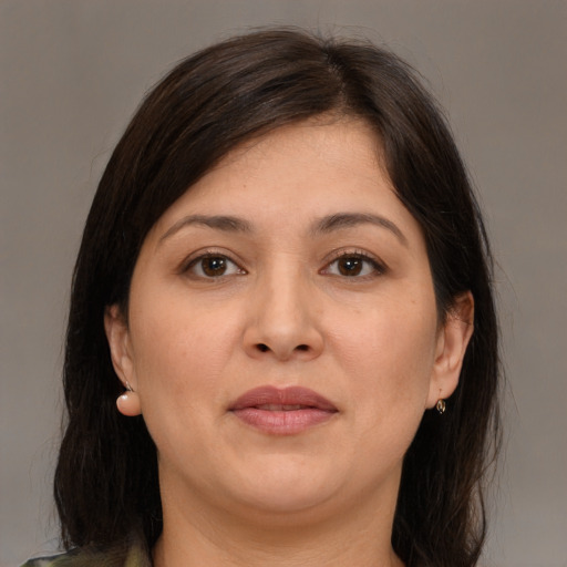 Joyful white adult female with medium  brown hair and brown eyes