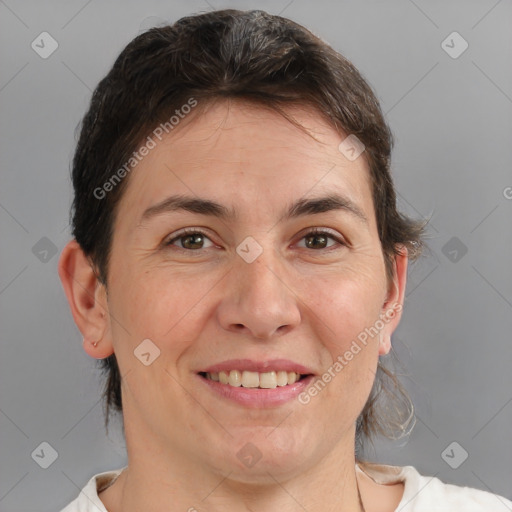 Joyful white adult female with medium  brown hair and brown eyes