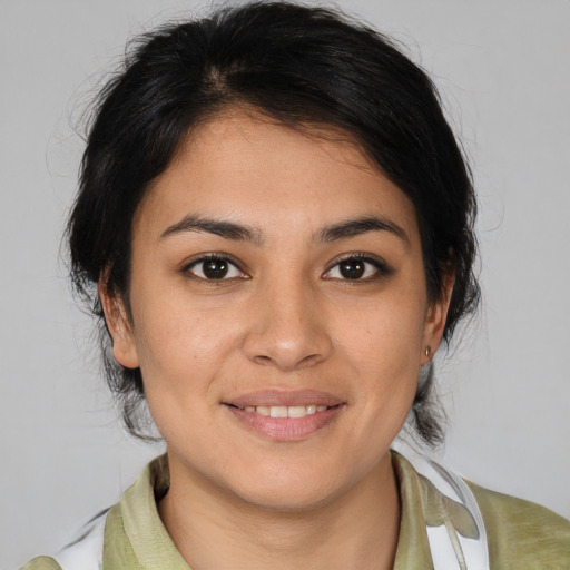 Joyful asian young-adult female with medium  brown hair and brown eyes