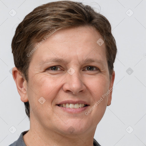 Joyful white adult female with short  brown hair and grey eyes