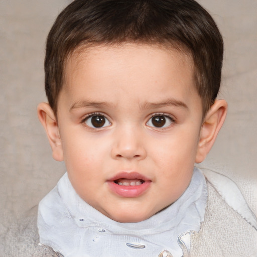 Joyful white child male with short  brown hair and brown eyes