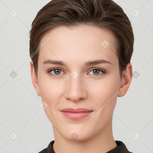 Joyful white young-adult female with short  brown hair and grey eyes