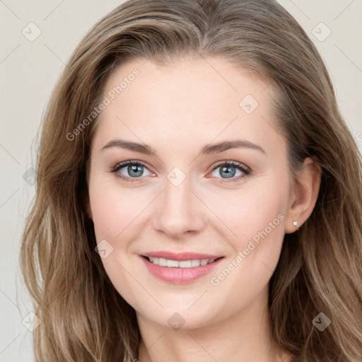 Joyful white young-adult female with long  brown hair and blue eyes