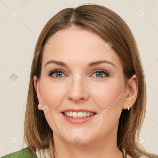 Joyful white young-adult female with medium  brown hair and green eyes