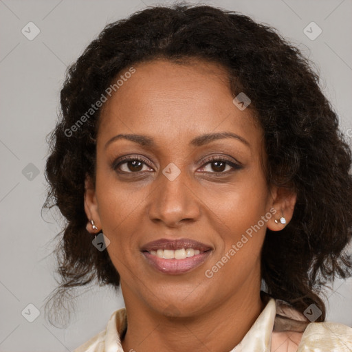 Joyful black adult female with medium  brown hair and brown eyes