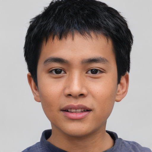 Joyful asian child male with short  black hair and brown eyes