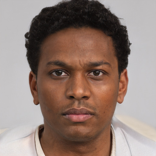 Neutral black young-adult male with short  brown hair and brown eyes