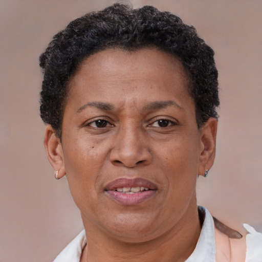 Joyful latino adult female with short  brown hair and brown eyes
