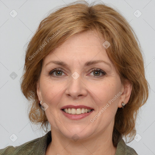 Joyful white adult female with medium  brown hair and grey eyes