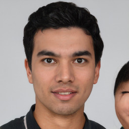 Neutral white young-adult male with short  black hair and brown eyes