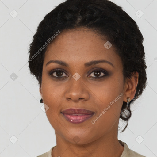 Joyful black young-adult female with short  brown hair and brown eyes
