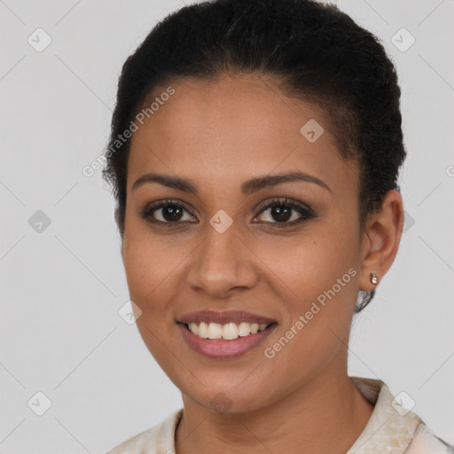 Joyful latino young-adult female with short  brown hair and brown eyes