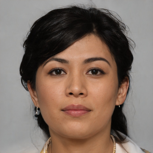 Joyful asian young-adult female with medium  black hair and brown eyes