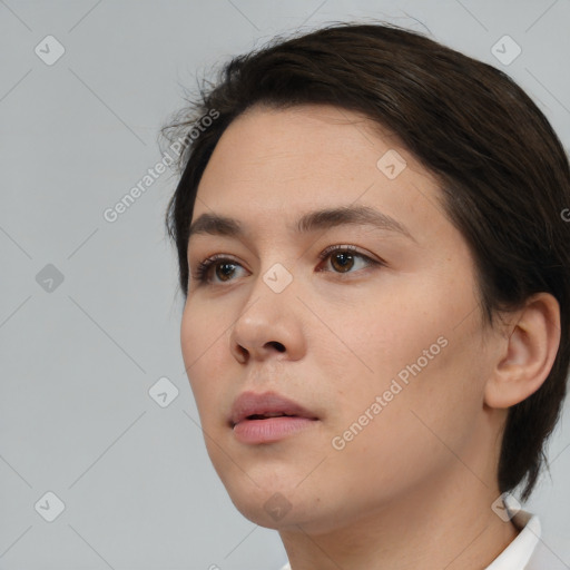 Neutral white young-adult female with medium  brown hair and brown eyes