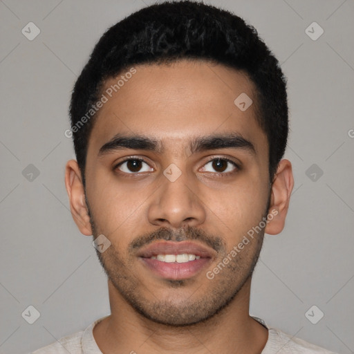 Joyful latino young-adult male with short  black hair and brown eyes