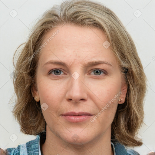 Joyful white young-adult female with medium  brown hair and blue eyes