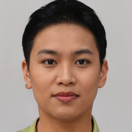 Joyful asian young-adult female with short  black hair and brown eyes