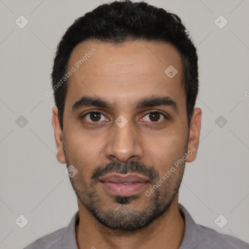 Joyful latino young-adult male with short  black hair and brown eyes