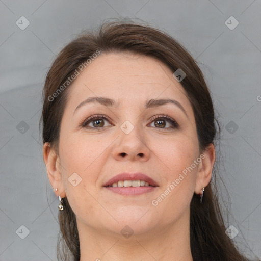 Joyful white adult female with medium  brown hair and brown eyes