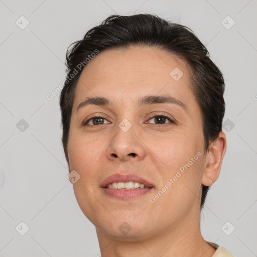 Joyful white adult female with short  brown hair and brown eyes