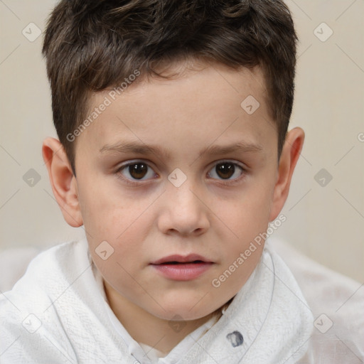 Joyful white child male with short  brown hair and brown eyes