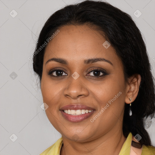 Joyful black young-adult female with medium  brown hair and brown eyes