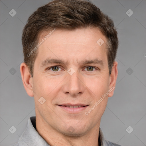 Joyful white adult male with short  brown hair and brown eyes