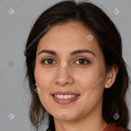 Joyful white young-adult female with long  brown hair and brown eyes