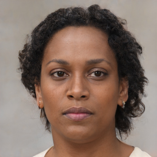 Neutral black adult female with short  brown hair and brown eyes