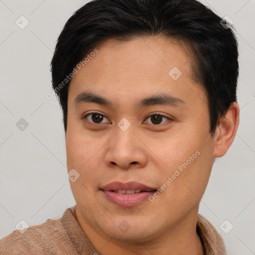 Joyful asian young-adult male with short  brown hair and brown eyes