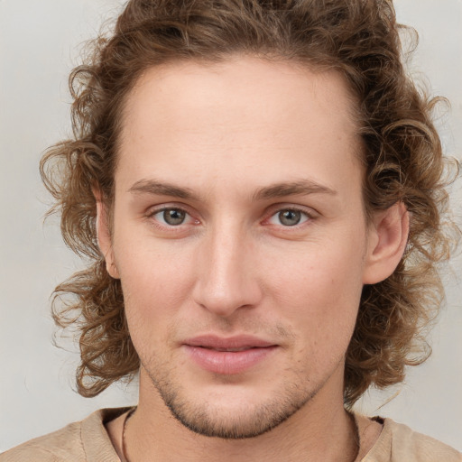 Joyful white young-adult male with medium  brown hair and brown eyes