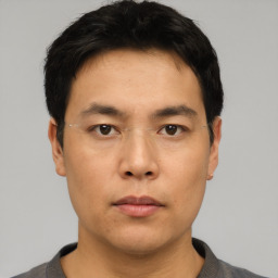 Neutral asian young-adult male with short  black hair and brown eyes