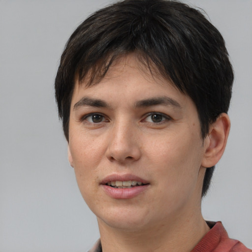 Joyful asian young-adult female with short  brown hair and brown eyes