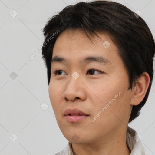 Neutral asian young-adult male with short  brown hair and brown eyes