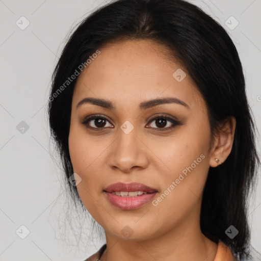 Joyful latino young-adult female with long  brown hair and brown eyes