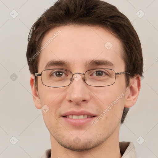 Joyful white young-adult male with short  brown hair and grey eyes