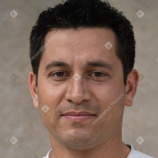 Joyful white adult male with short  black hair and brown eyes