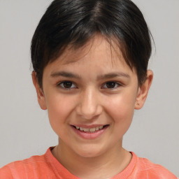 Joyful white child female with short  brown hair and brown eyes