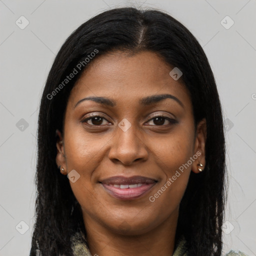 Joyful black young-adult female with long  brown hair and brown eyes