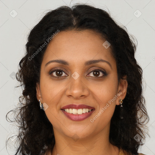 Joyful black young-adult female with long  brown hair and brown eyes