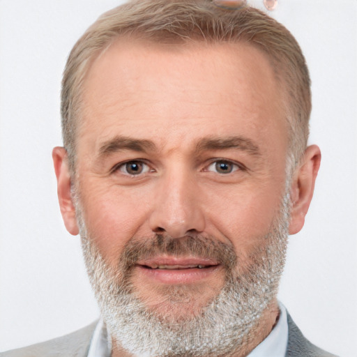 Joyful white middle-aged male with short  brown hair and brown eyes