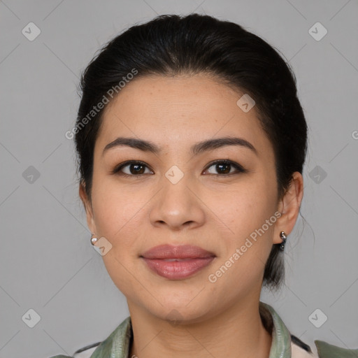 Joyful latino young-adult female with medium  brown hair and brown eyes