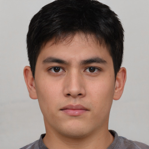 Neutral asian young-adult male with short  brown hair and brown eyes