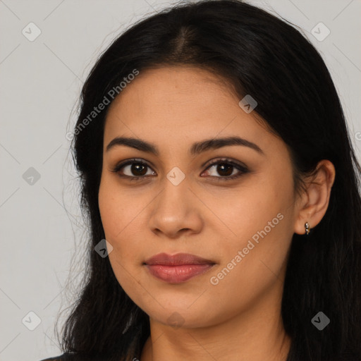 Joyful latino young-adult female with long  brown hair and brown eyes