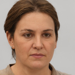 Joyful white adult female with short  brown hair and grey eyes