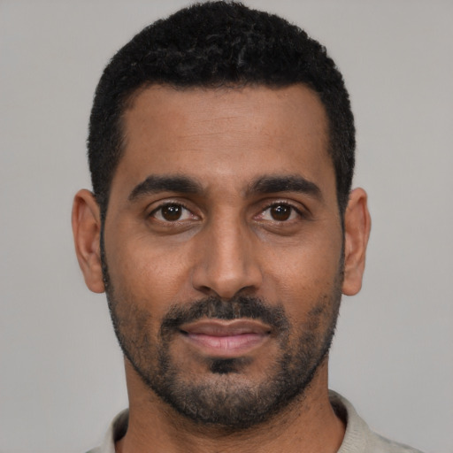 Neutral black young-adult male with short  black hair and brown eyes