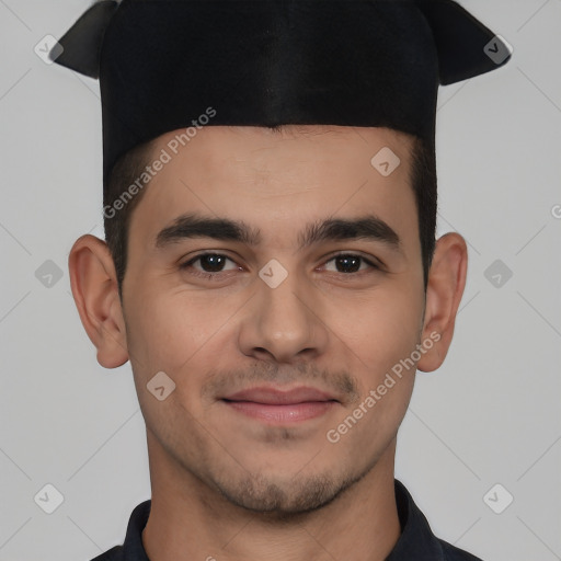 Joyful white young-adult male with short  black hair and brown eyes