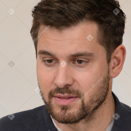 Joyful white adult male with short  brown hair and brown eyes